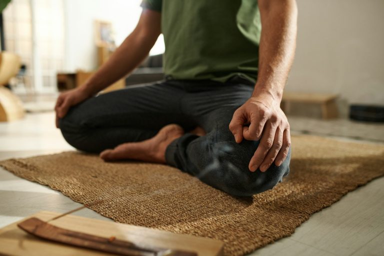 Man sitting in lotus position