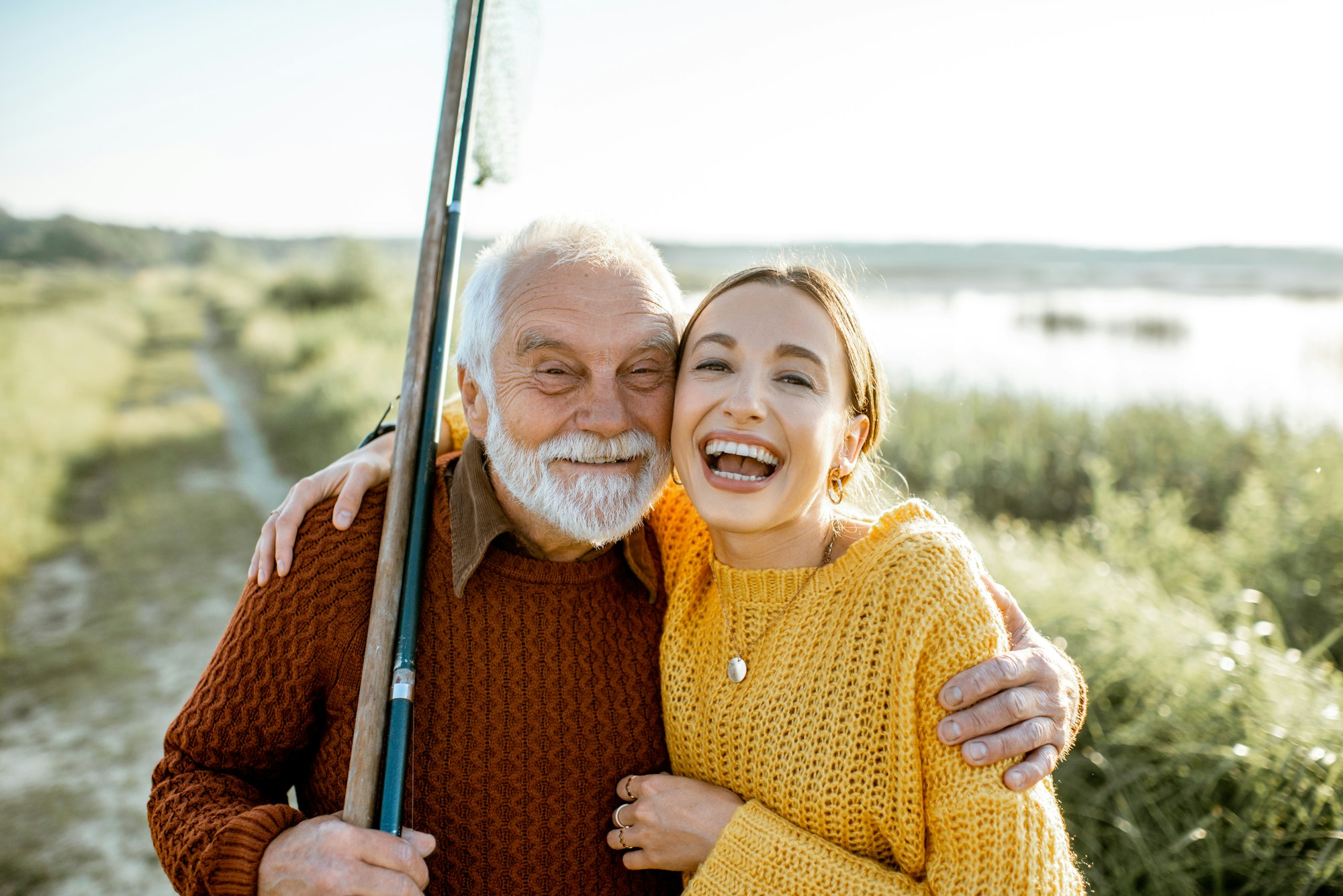 Grandfather with daughter outdoors