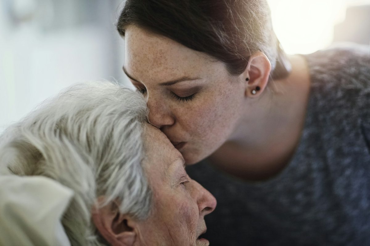 The love between a mother and daughter. Shot of a daughter visiting her senior mother in hospital.