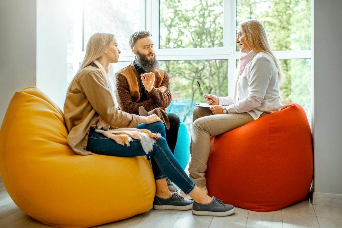 Young couple during the psychological counseling with psychologist