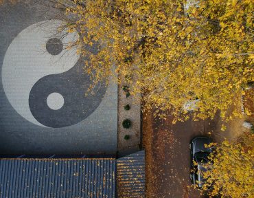 aerial photo of a yin yang sign in the park in autumn