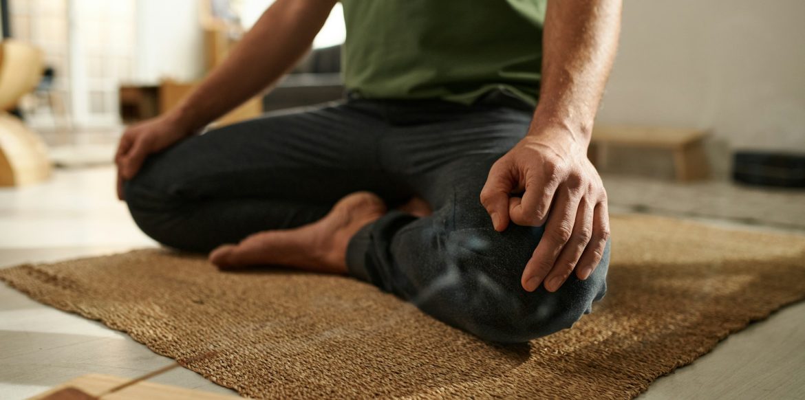 Man sitting in lotus position