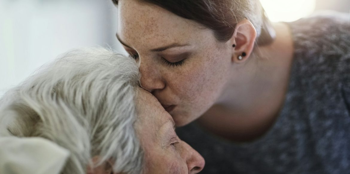 The love between a mother and daughter. Shot of a daughter visiting her senior mother in hospital.