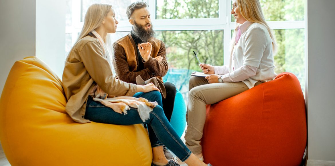 Young couple during the psychological counseling with psychologist